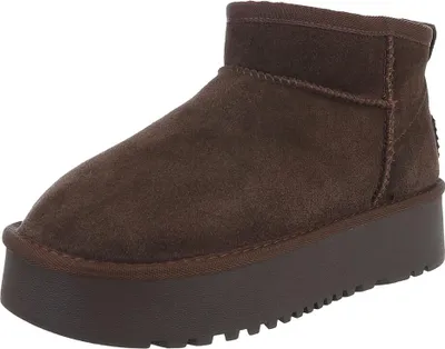 A single brown boot with a platform sole is shown against a white background.