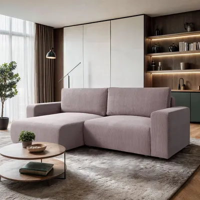A modern living room with a pink sectional sofa, coffee table, and bookshelf.