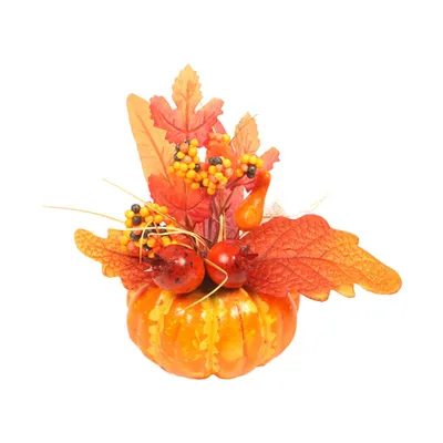 A decorative autumn arrangement featuring a small pumpkin adorned with artificial leaves, berries, and ladybug-like ornaments.