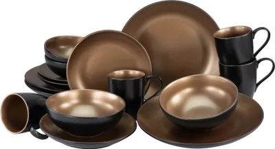 A collection of dinnerware, including plates, bowls, and mugs, arranged on a white background.