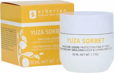 A product shot of a skincare emulsion jar and its packaging.