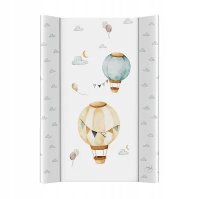 A flat lay image of a baby changing mat with a pattern of hot air balloons and clouds.