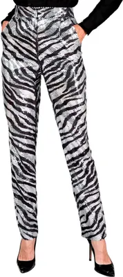 A person is wearing zebra-patterned sequined pants and black high heels.