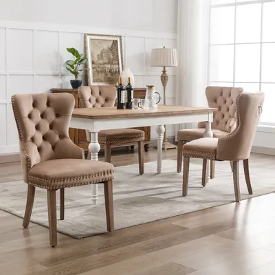 A dining room scene with a table and chairs.