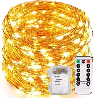 A coiled string of warm white LED lights with a battery pack and remote control.