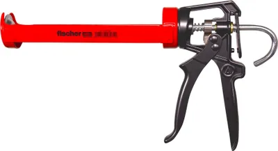 A red and black caulking gun on a white background.