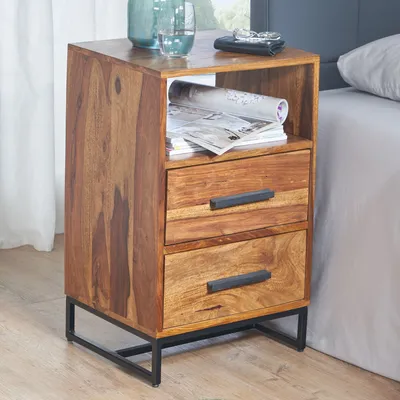 A wooden nightstand with two drawers and an open shelf, placed next to a bed.