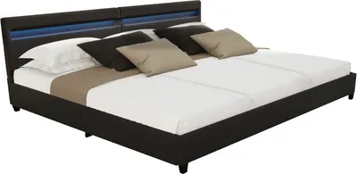 A modern black bed with blue LED lighting in the headboard, shown with pillows and bedding.