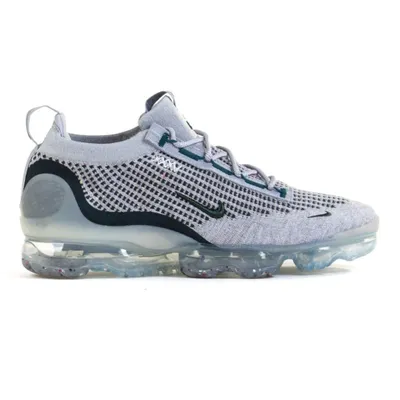A side view of a Nike Air Vapormax 2021 FK SE shoe against a white background.