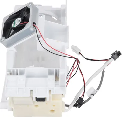 A close-up shot of a white appliance component with a fan and wiring.