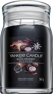 A Yankee Candle Black Coconut scented candle in a glass jar with a black label.