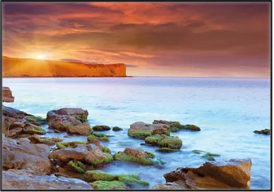 Produktbild von Wallario Wandbild Sonnenaufgang am Meer mit Landzunge und Felsen im Wasser, Größe: 70,30 x 100,30 cm, Poster mit schwarzem Aluminiumrahmen