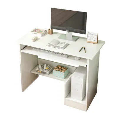 A white computer desk with a monitor, keyboard, mouse, and decorative items.
