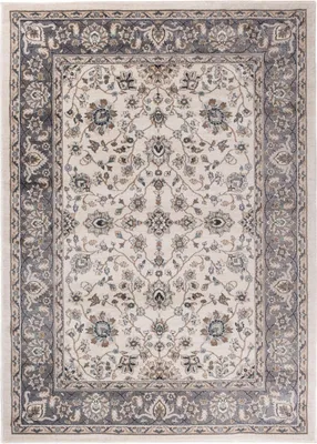 A top-down view of a rectangular rug with a classic floral pattern.