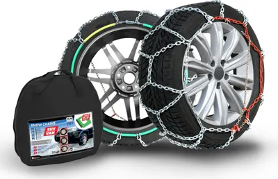 A black carrying bag and two snow chains on car tires.