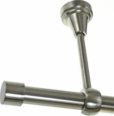 A close-up view of a metal curtain rod with a ceiling mount.