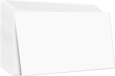 A stack of white, rectangular ceiling tiles is shown, with one tile angled forward.