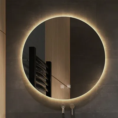 A round LED mirror mounted on a dark tiled wall.