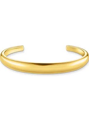 A plain studio shot of a gold cuff bracelet.