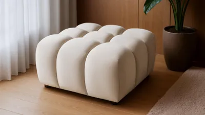 Produktbild von Polsterhocker Designerhocker FLOW in Stoff Bluvel Creme