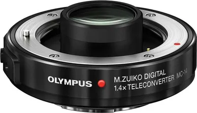 A close-up studio shot of an Olympus M.Zuiko Digital 1.4x Teleconverter MC-14.
