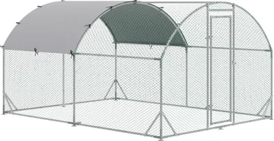 A silver and gray chicken coop with a semicircular roof and a door.
