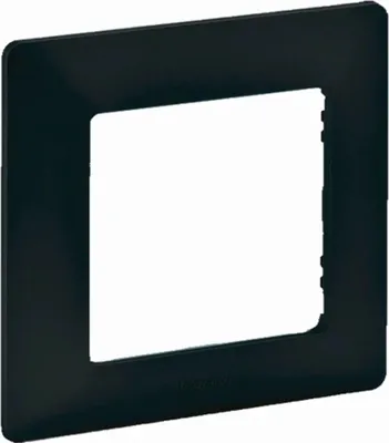 A black frame for an electrical outlet or switch.