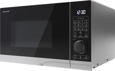 A studio shot of a silver and black Sharp microwave oven.