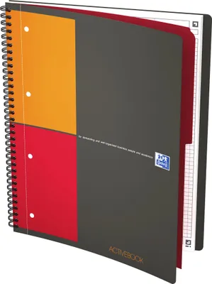 An open spiral-bound notebook with a dark gray cover featuring orange and red blocks on the left side. The right side shows graph paper pages. The notebook is slightly angled.