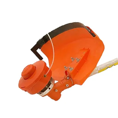 Close-up of a string trimmer head and guard.