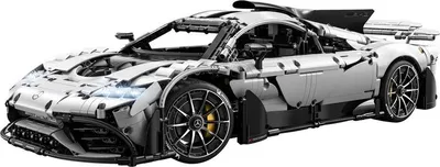 A white Lego model of a Mercedes-AMG Project One car is shown from a 3/4 angle against a white background.