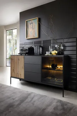 A modern sideboard with wood accents and LED lighting, displayed in a room setting.