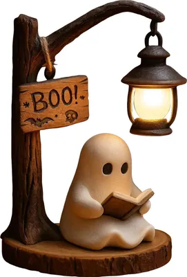 A Halloween-themed decorative lamp featuring a ghost reading a book under a street lamp.