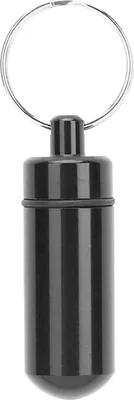 A black pill holder keychain on a white background.