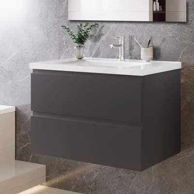 A modern bathroom vanity with a white countertop and two dark gray drawers, set against a gray marble tiled wall.