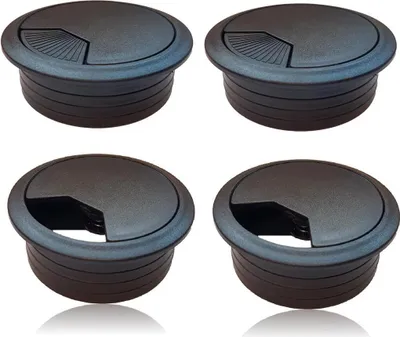 Four black cable grommets are arranged in a two-by-two grid against a white background.