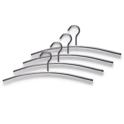 A set of four metal hangers arranged diagonally on a white background.