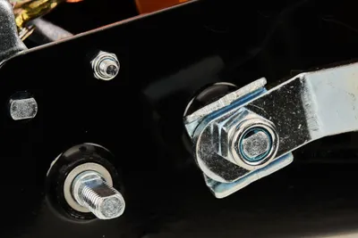 A close-up view of metal hardware, likely part of a winch mechanism.