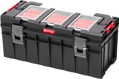 A black Qbrick System Pro 600 Profi-Werkzeugkasten tool box with red inserts and clear lids.