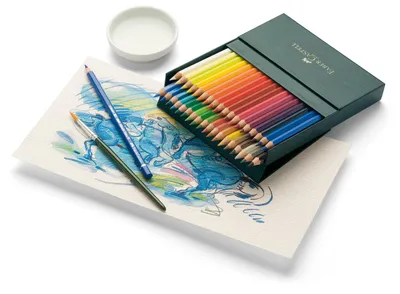 A set of Faber-Castell watercolor pencils is displayed on a white surface, next to a partially completed watercolor painting and a small dish of water.