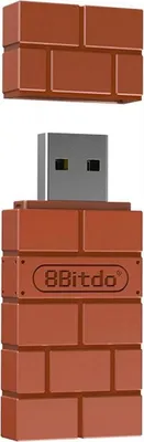 A product shot of a USB adapter designed to look like a brick from Super Mario.