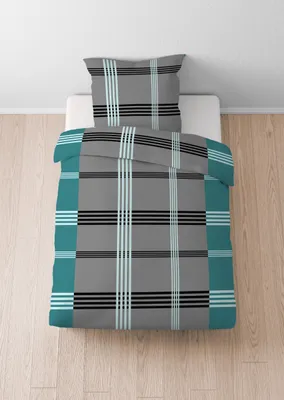 A duvet cover and pillowcase set with a plaid pattern is laid out on a white surface.