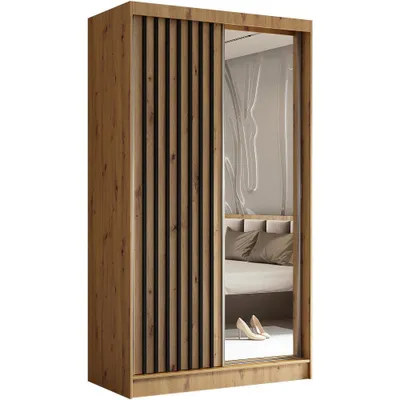 A wardrobe with sliding doors, one of which is a mirror, reflecting a bedroom interior. The wardrobe has a wooden finish and slatted detailing on one door.