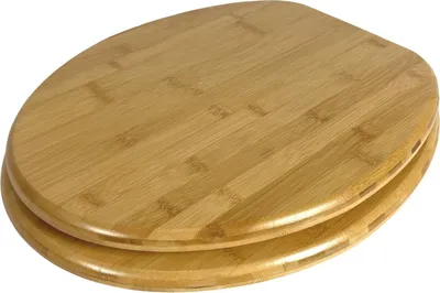A close-up, angled view of a closed toilet seat made of bamboo.