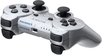 A silver PlayStation 3 DualShock 3 wireless controller is shown against a white background.