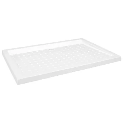 A white shower tray with a textured surface and a drain hole.