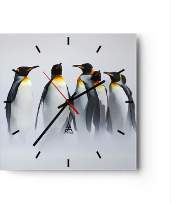 A square clock with a picture of penguins on it.