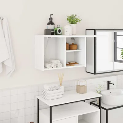 A white bathroom wall shelf with various bathroom accessories.
