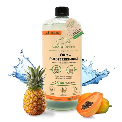 A bottle of cleaning product with fruit and water splashes.