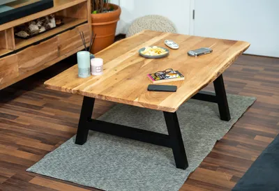 Produktbild von Couchtisch Baumkante 120x80 cm Akazie Naturfarben schwarz A-Gestell